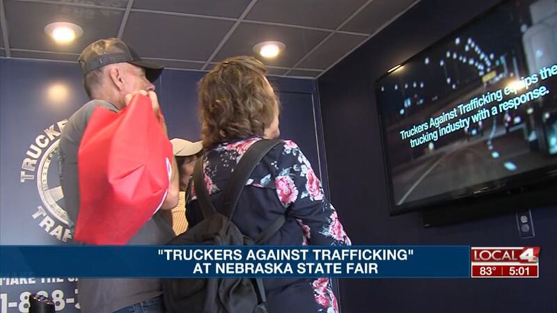 People look at the stories of human trafficking victims at the Truckers Against Trafficking's...