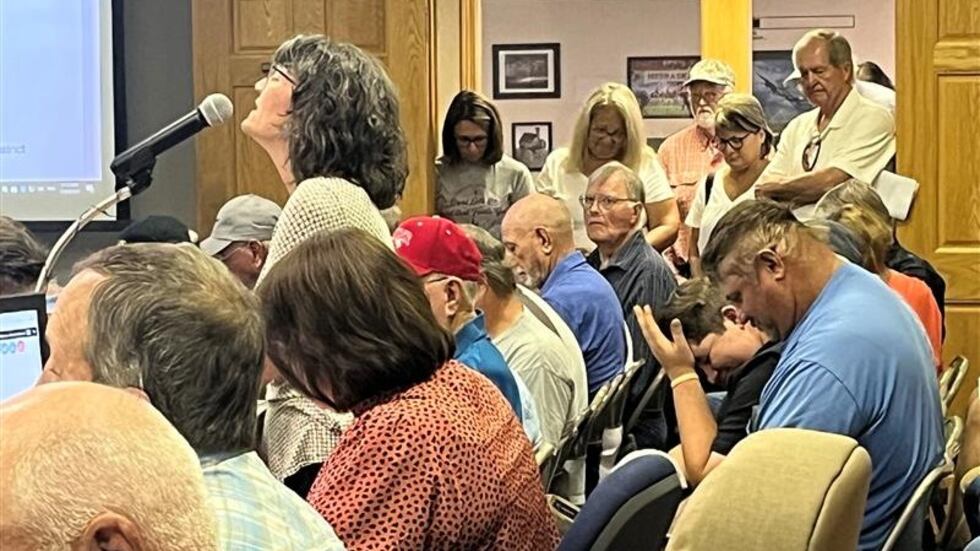 The board room was packed with people against a proposed merger between power districts.