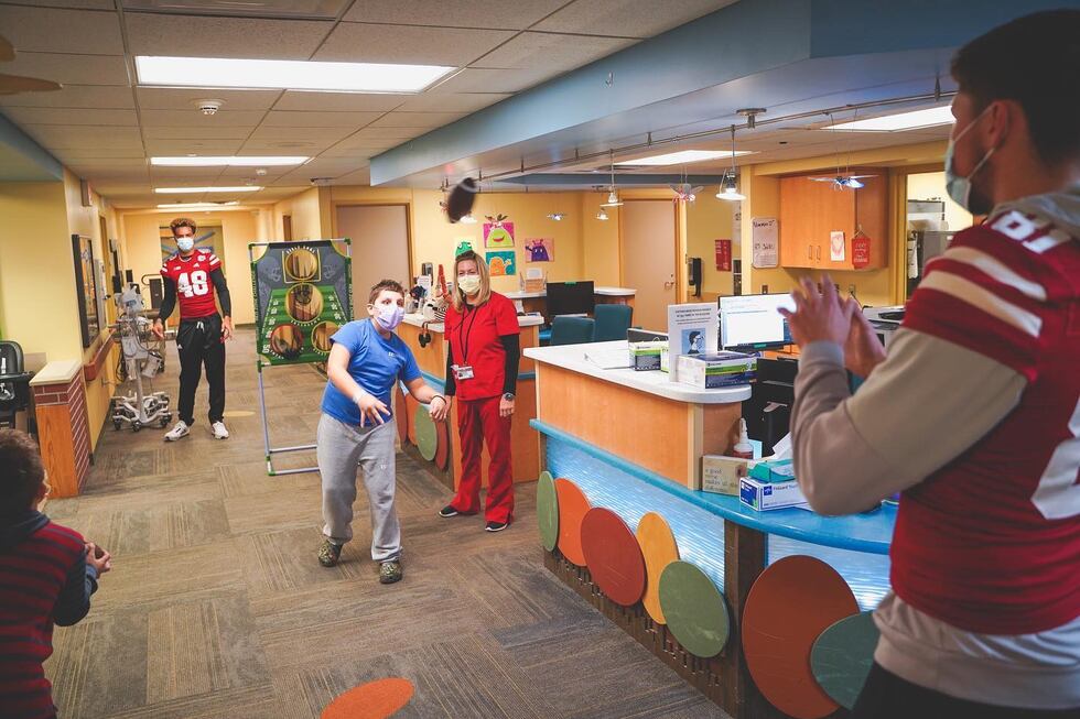 James Carnie plays catch with a patient