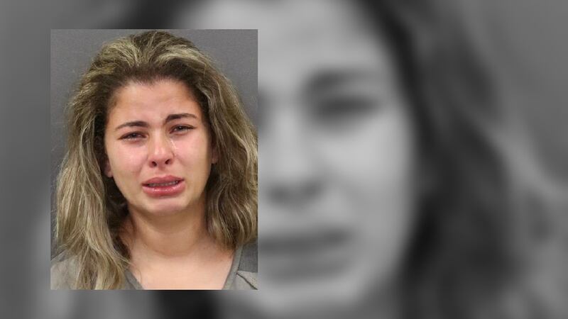 Nayade Sardinas Cue was arrested after children were found unattended in her car.