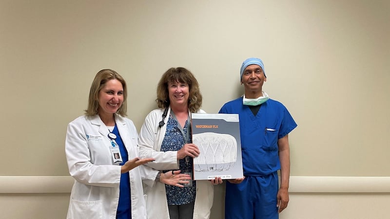 Dr. Linda Ferrer, Valerie Fredericksen, APRN, and Dr. Vivek Varma pose for a photograph before...
