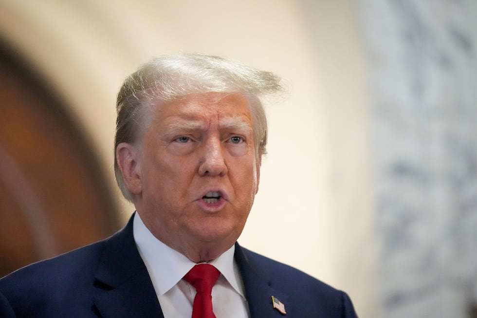 Former President Donald Trump speaks to the media before entering the courtroom at New York...