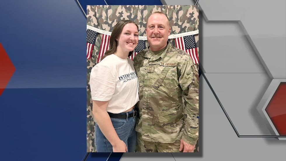 Paiton Martin and her father Chad pose for a photo Tuesday evening during Sisters for...