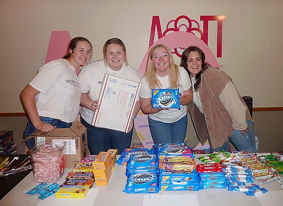 With help from the campus and Kearney communities, members of the Alpha Omicron Pi sorority...