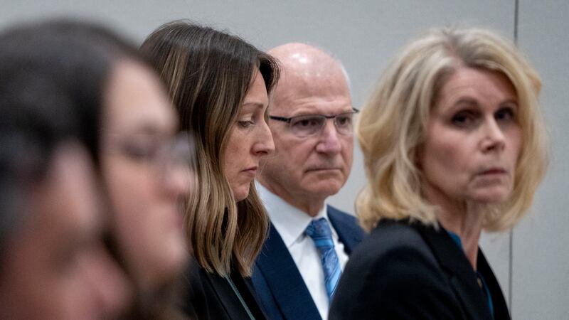 Dr. Caitlin Bernard, left, sits between attorneys John Hoover and Alice Morical on Thursday...