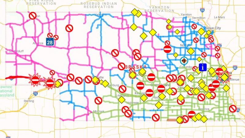 Red lines mean the road is closed. Pink lines means the road is completely covered by snow....