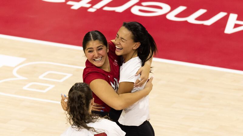 Nebraska volleyball players Lexi Rodriguez and Harper Murray hug following a point during the...