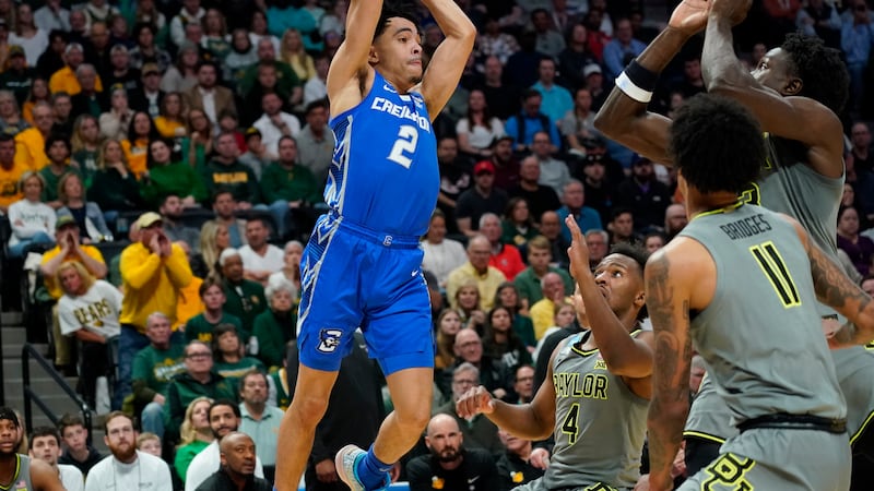 Creighton guard Ryan Nembhard, left, looks to pass the ball as Baylor forward Jalen Bridges,...